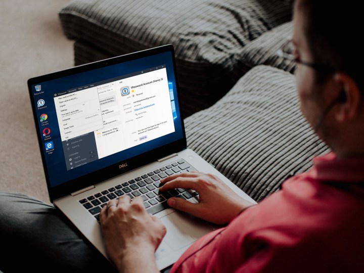 Customer using 1Password on their Windows laptop, sitting on a couch.