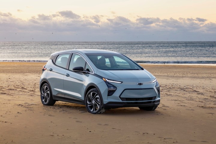 alt text: A Chevy Bolt parked on the beach.