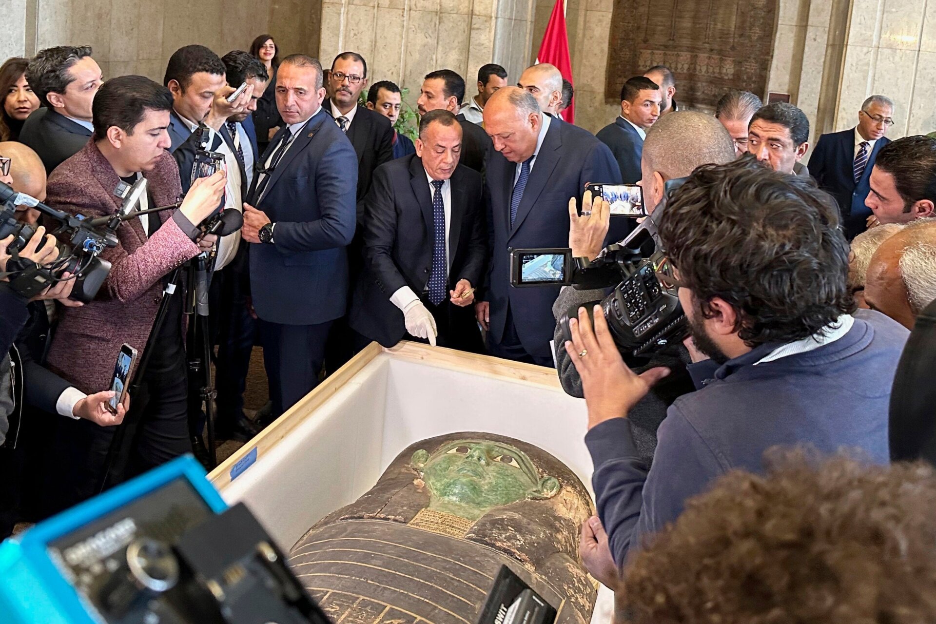 Ancient Egyptian sarcophagus returned to Egypt. This wooden coffin, adorned with hieroglyphics and a green painted face, dates back to the Late Dynastic Period.