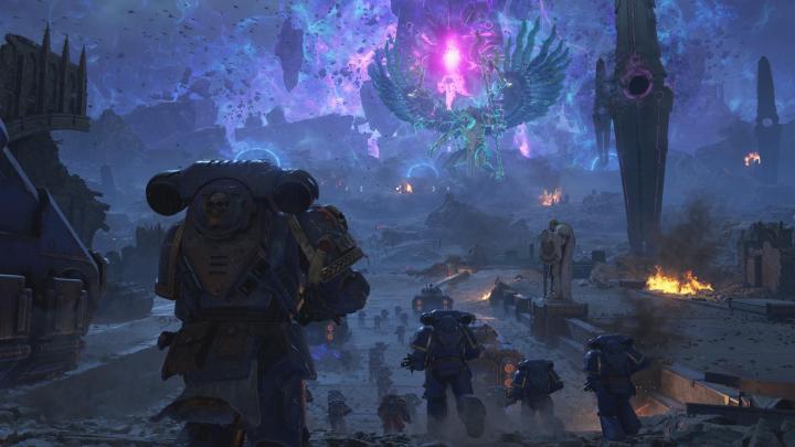 The image shows Space Marines advancing, with a Lord of Change seen in the distance.