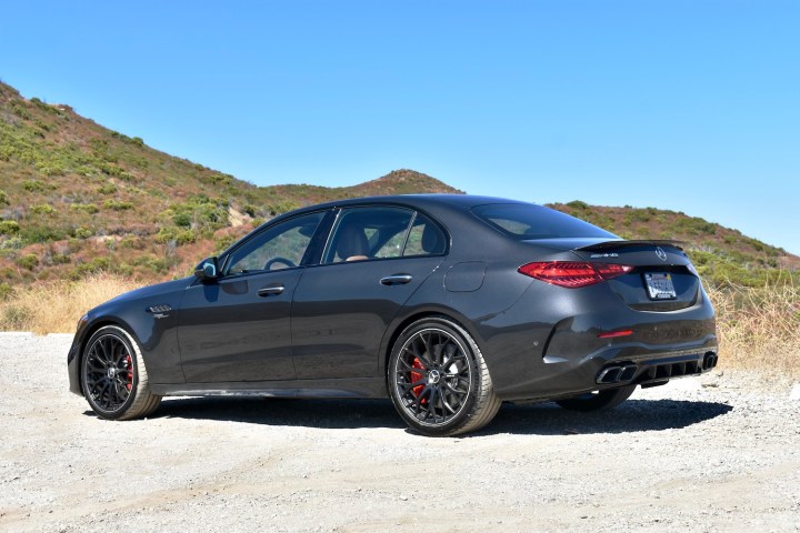 alt text: The 2025 Mercedes-AMG C63 S E Performance viewed from the rear quarter angle, showcasing its sporty design and performance features.