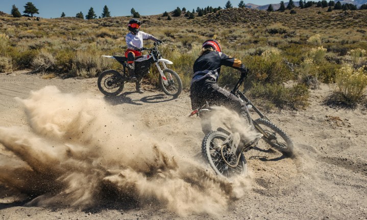 Alt text: Two riders with Zero motorcycles, one stationary and the other performing a donut.