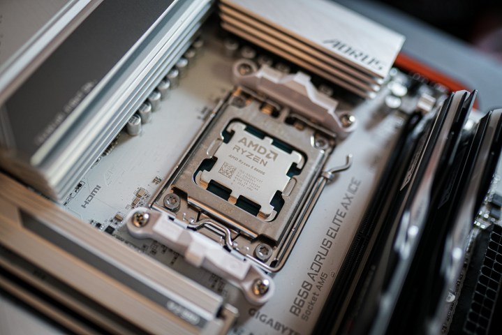 alt text: A close-up view of an AMD Ryzen 5 8600G APU installed in a motherboard socket.