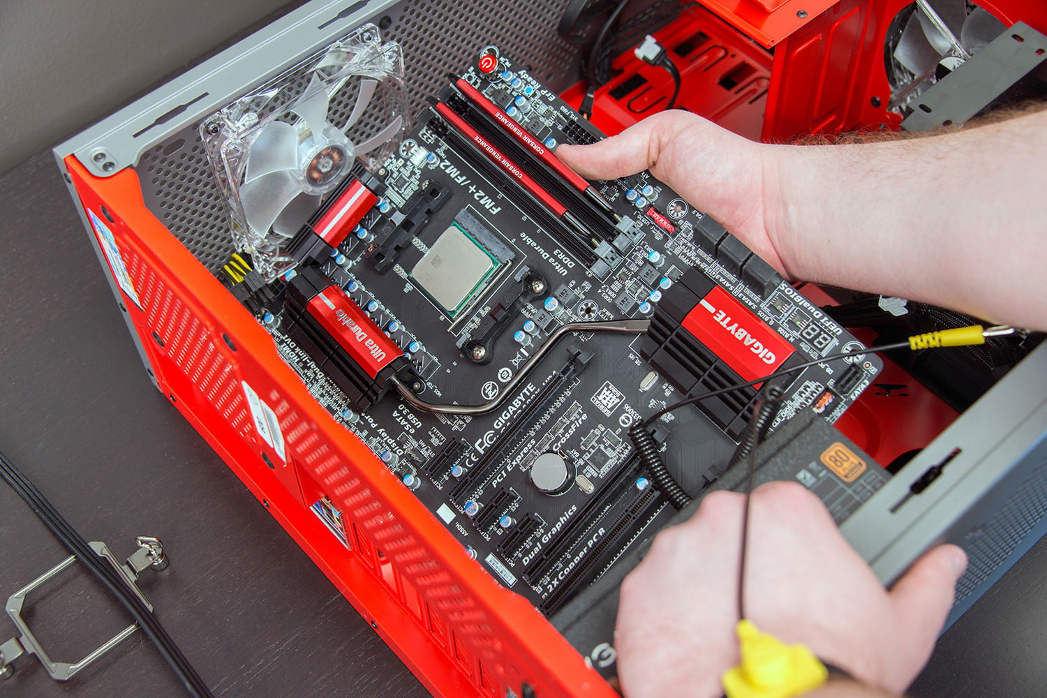 Installing the motherboard into the PC case.