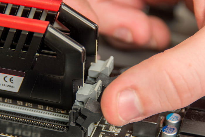 Installing RAM modules into motherboard slots.