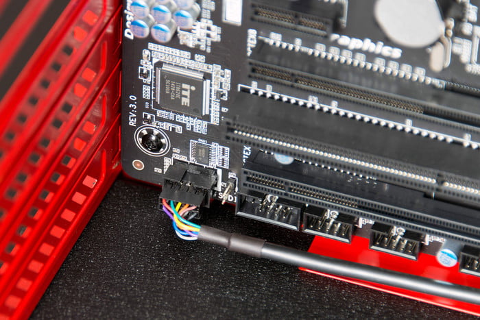 Connecting the 24-pin power connector to the motherboard.