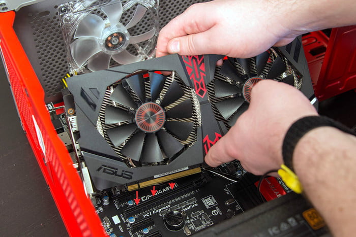 Inserting the graphics card into the PCIe slot.