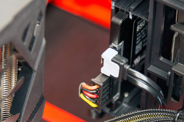 Connecting a SATA cable to an SSD.