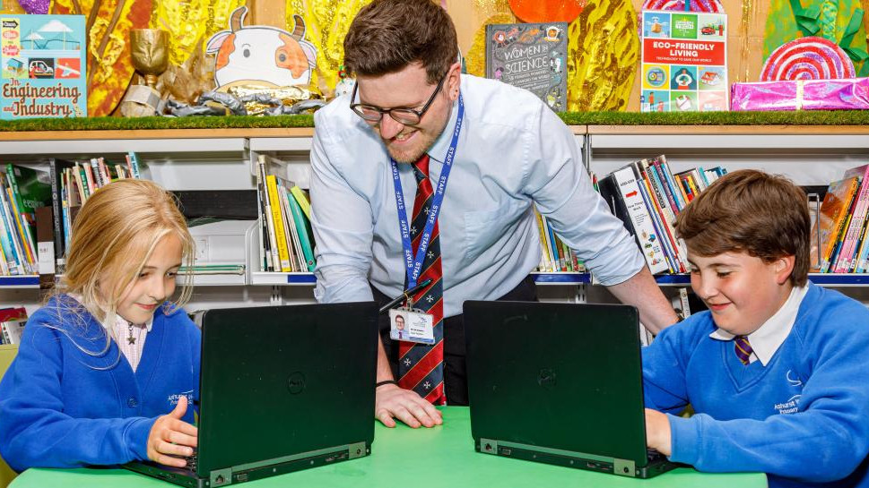 Alt: A collection of donated laptops from Computer Aid, ready to be distributed to those in need, demonstrating the positive impact of donating used electronics.