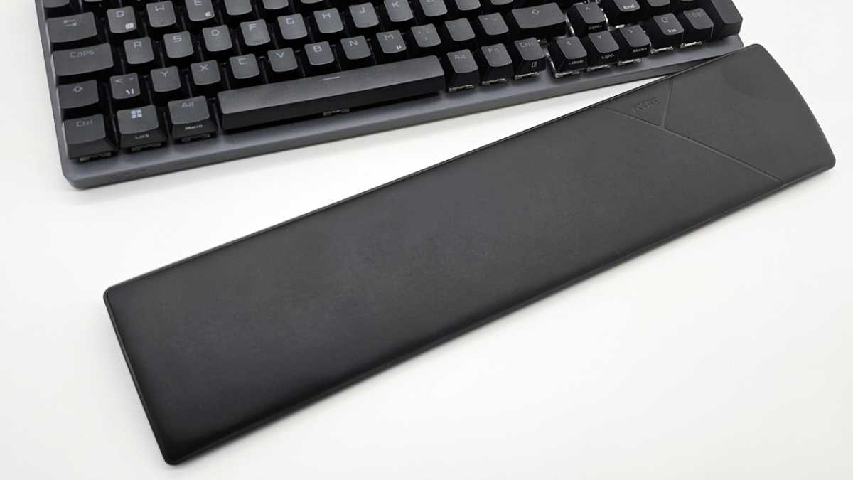 alt text: Detachable padded palm rest magnetically attached to the Asus ROG Strix Scope II 96 Wireless Gaming Keyboard.