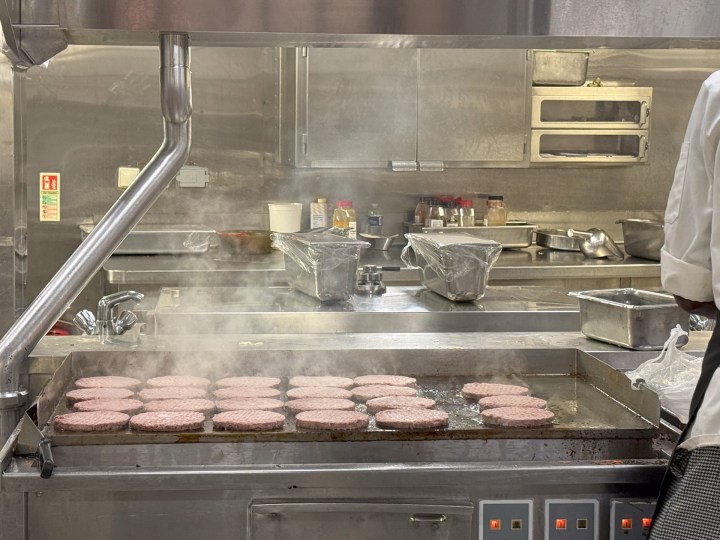 Burgers grilling in the galley aboard Royal Caribbean Allure of the Seas