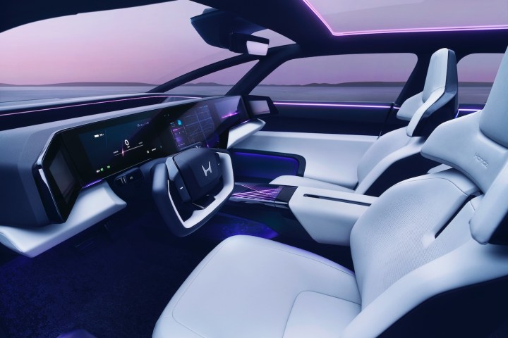 alt: Interior view of the Honda 0 Saloon prototype, showcasing its modern dashboard and technology.