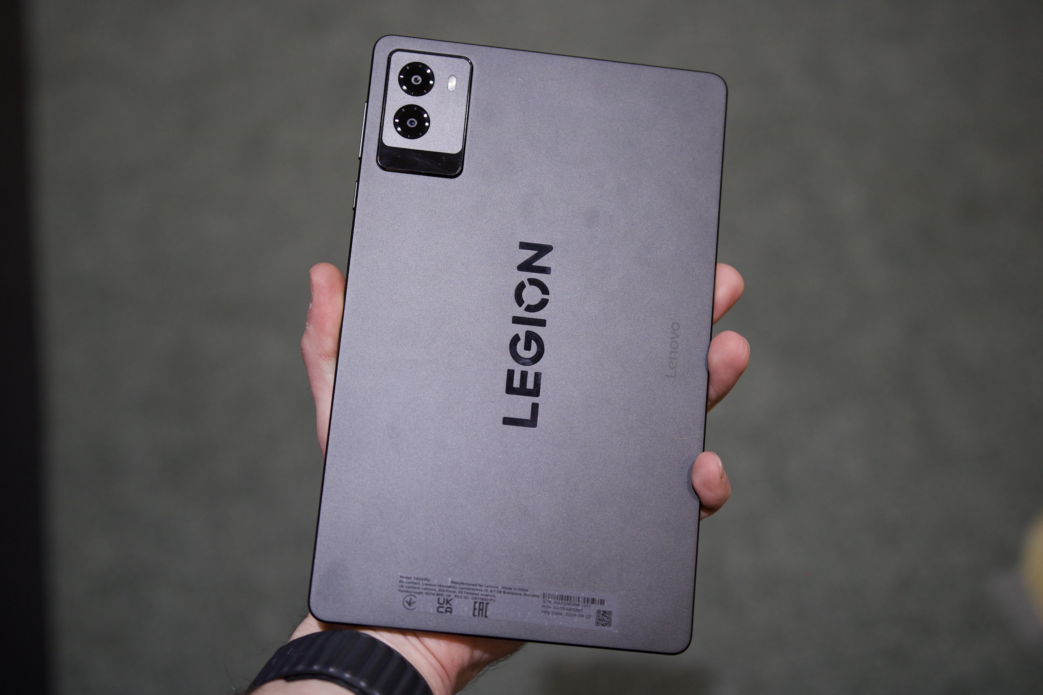 Someone holding the Lenovo Legion Tab Gen 3, showing the back of the tablet.