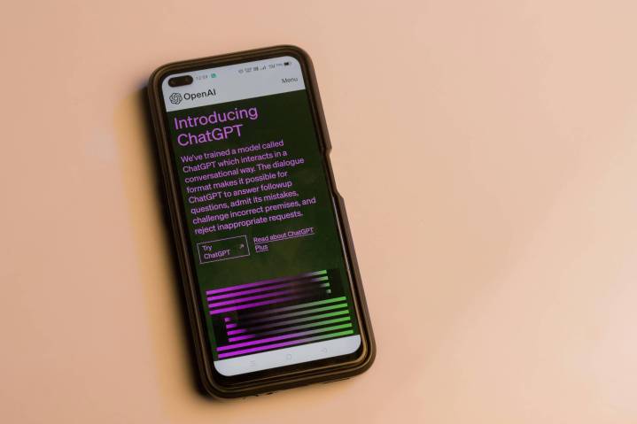 alt text: A phone displaying the ChatGPT homepage.