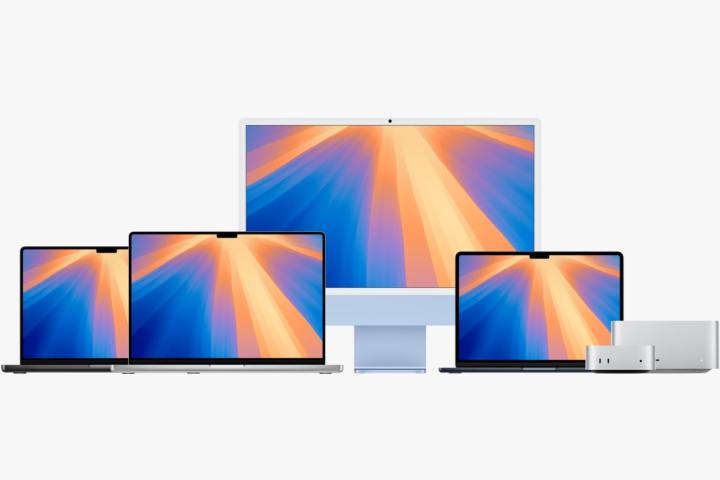 A range of Macs lined up against a white background.