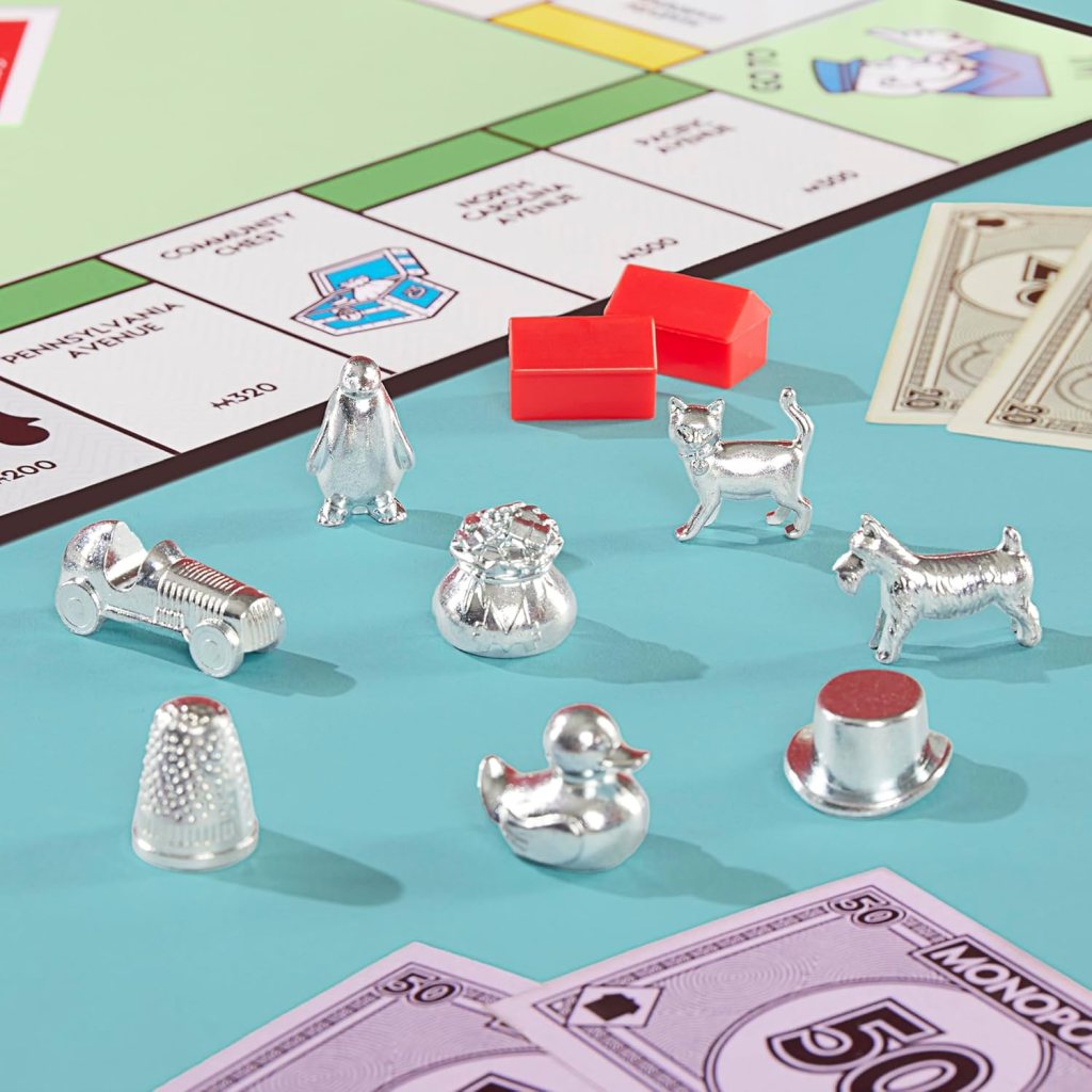 alt text: Close-up of the new Monopoly game board, tokens, and money.