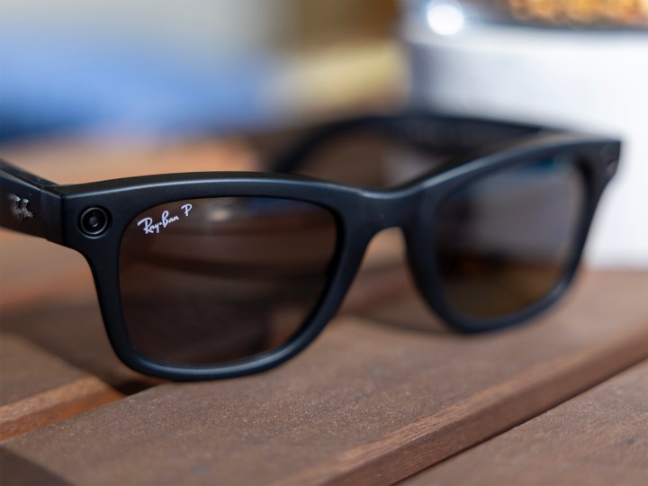 A pair of Ray-Ban Meta smartglasses on a table.