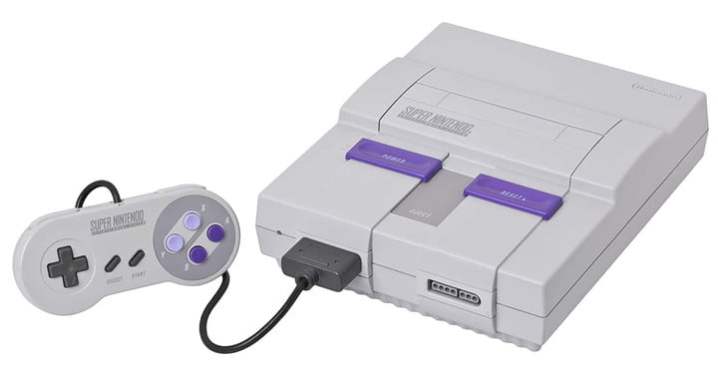 alt: A Super Nintendo Entertainment System (SNES) console with controller