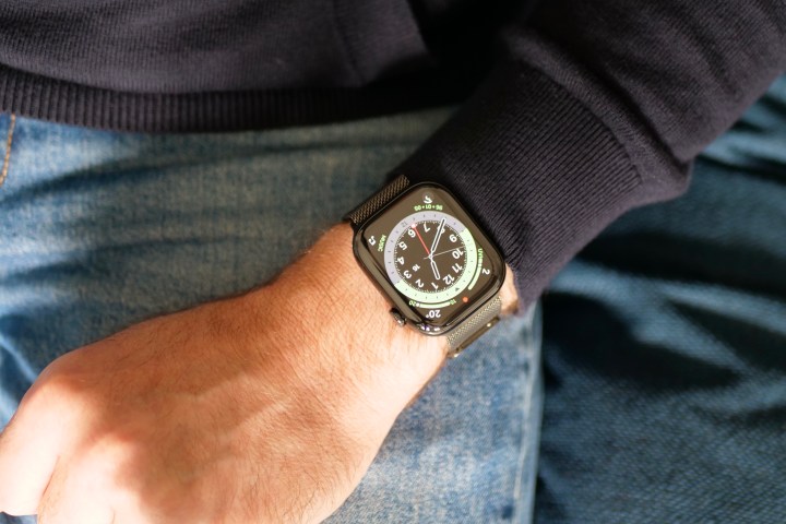 A person wearing the titanium Apple Watch Series 10.