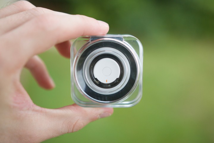 The Samsung Galaxy Ring in its charging case.