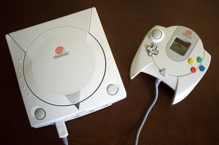 A Dreamcast sits on a table.