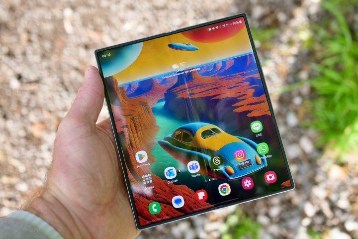 A person holding the open Samsung Galaxy Z Fold 6.