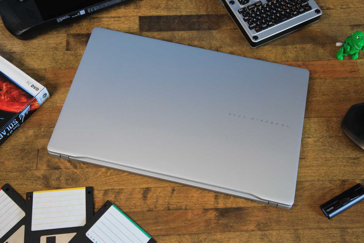 alt text: The Asus Vivobook S 15 open on a desk, showcasing its silver design and keyboard.