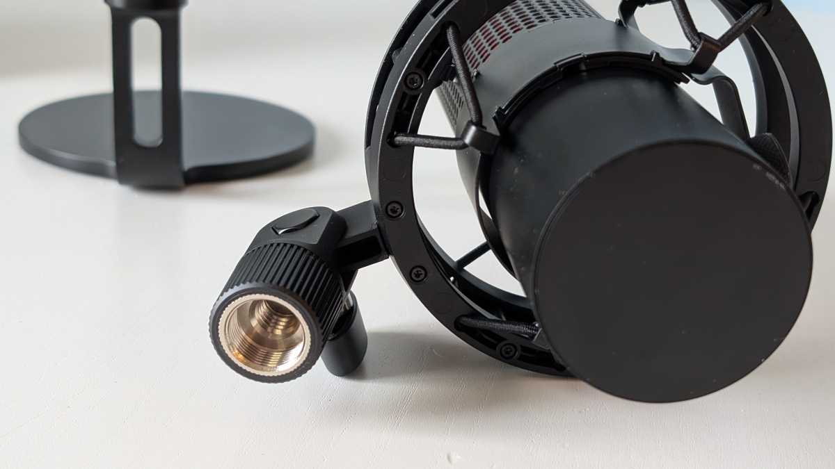 alt: Close-up of the HyperX QuadCast 2 attached to its stand