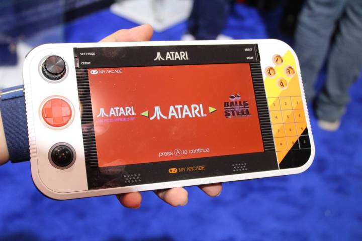 alt text: Close-up view of the Atari Gamestation Go's controller, showing the joystick, D-pad, trackball, buttons, and number pad.