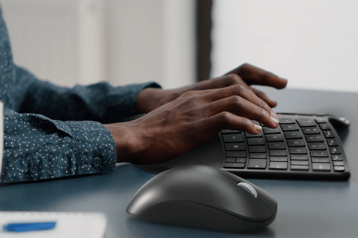 alt text: Close-up of the Microsoft Compact Ergonomic Keyboard, showcasing its sleek design and scissor keys.