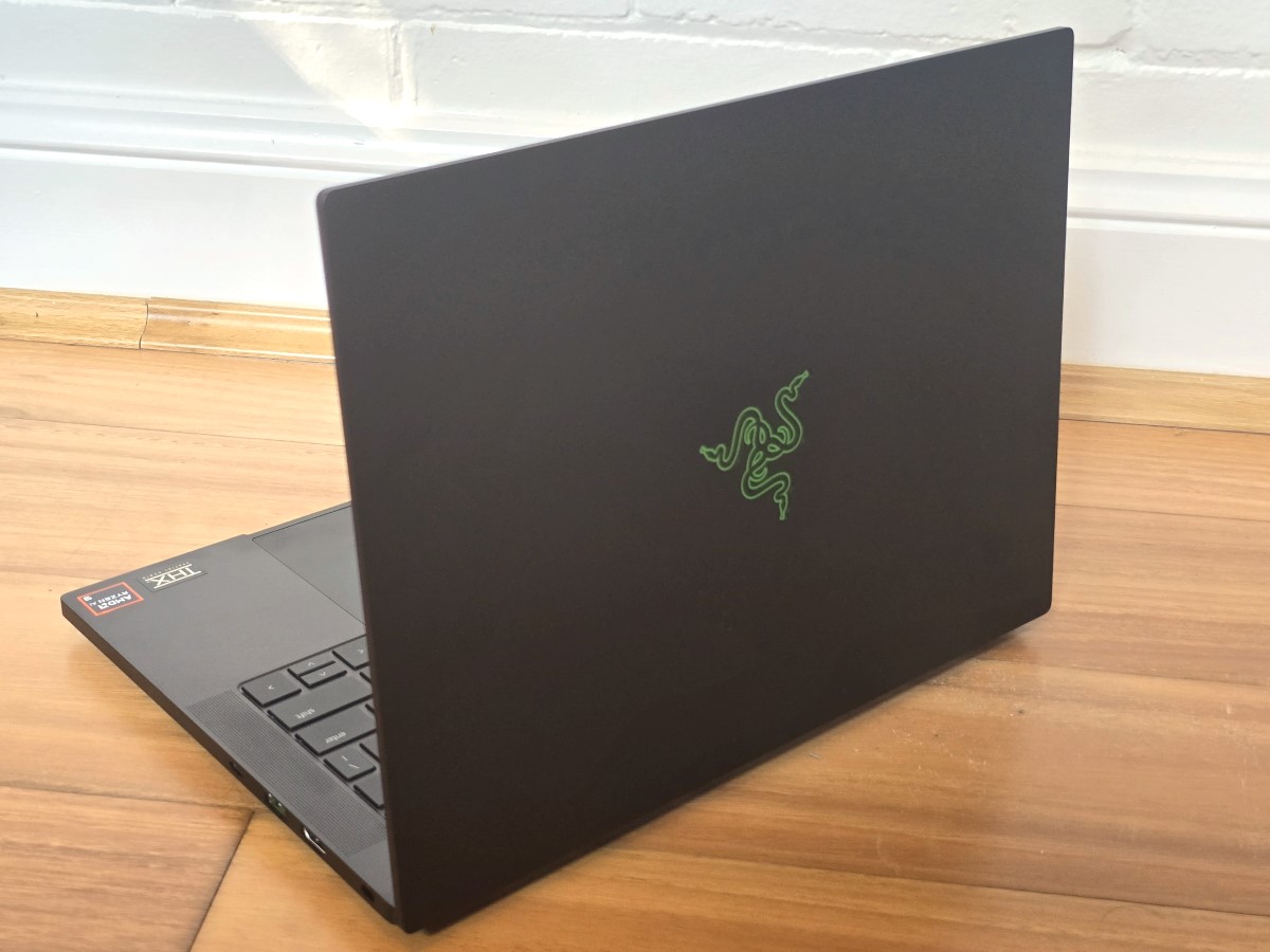 alt text: Close-up view of the Razer Blade 14, highlighting its sleek black chassis, keyboard, and trackpad.