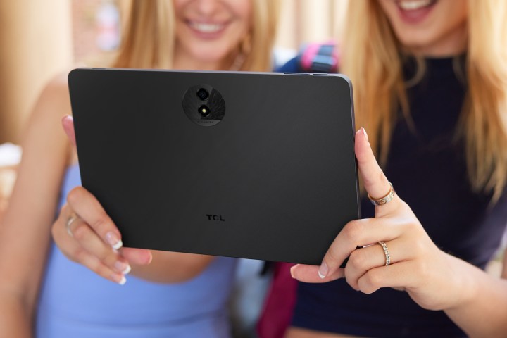 Someone holding the TCL Nxtpaper 11 Plus tablet.