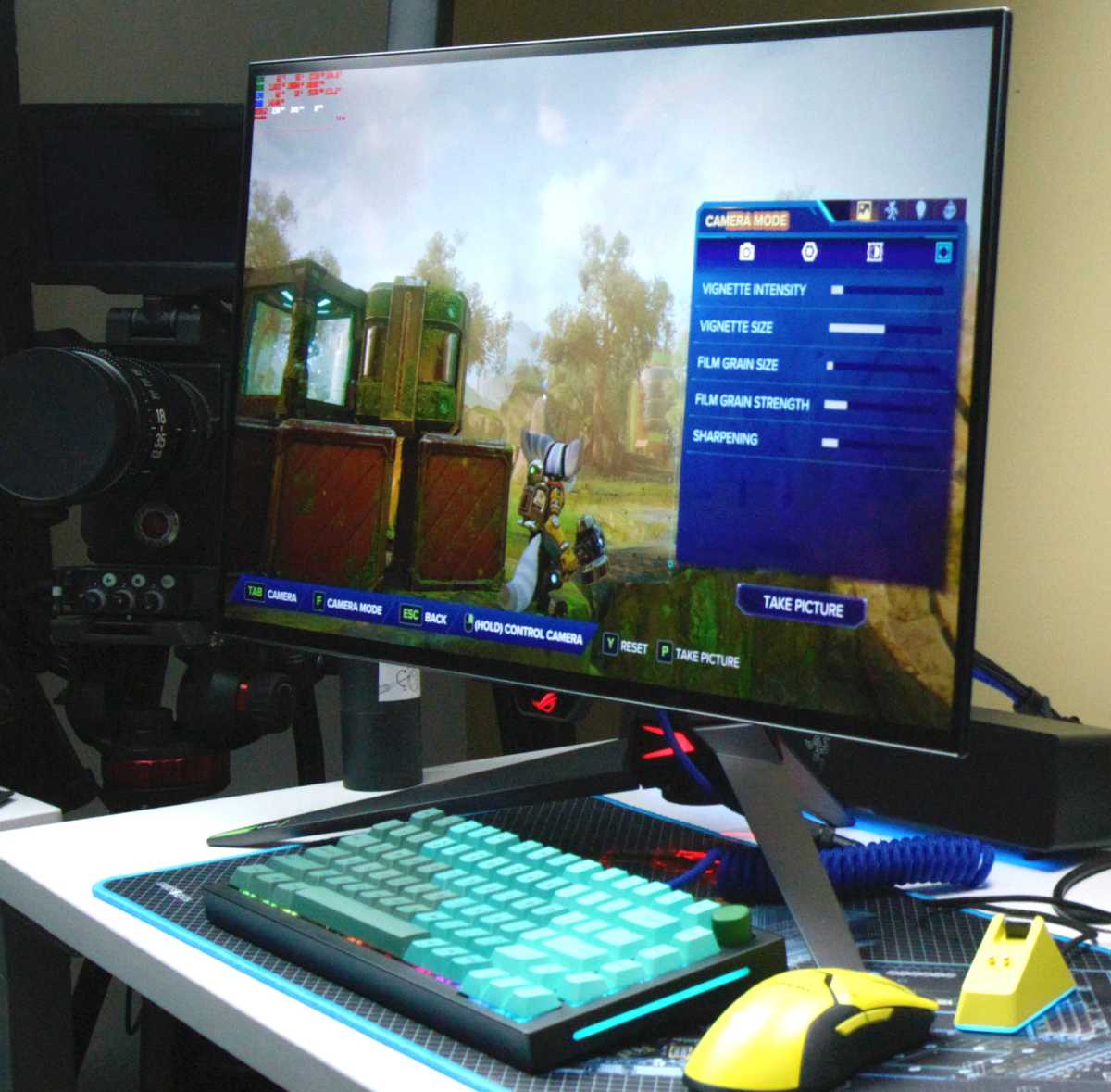 Large gaming monitor on desk used as external display for laptop