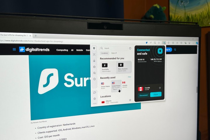 The Surfshark extension is running in the Edge browser on a PC monitor.