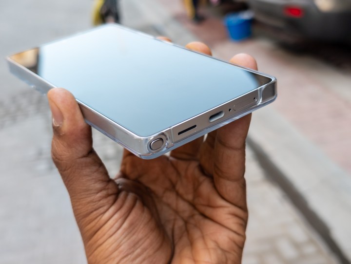 The USB port on the Galaxy S25 Ultra Magnetic Charging Cover attached to the phone in the hand