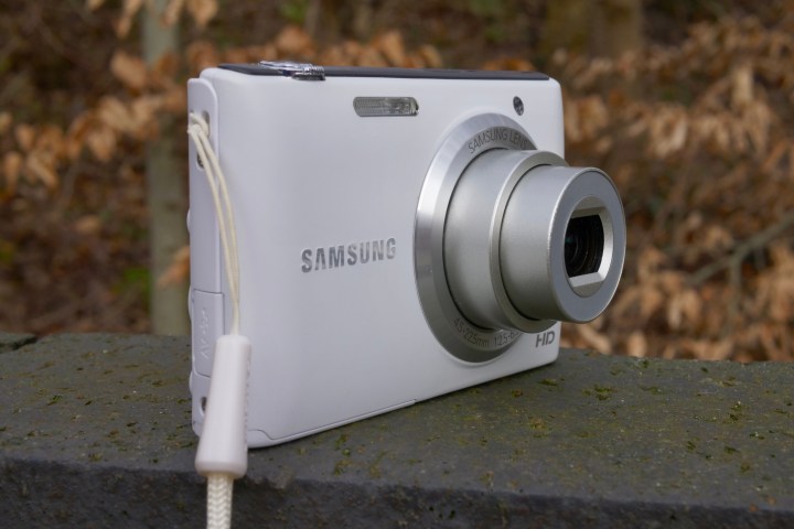 The side of the Samsung ST72 camera next to the Samsung Galaxy S25 Ultra.