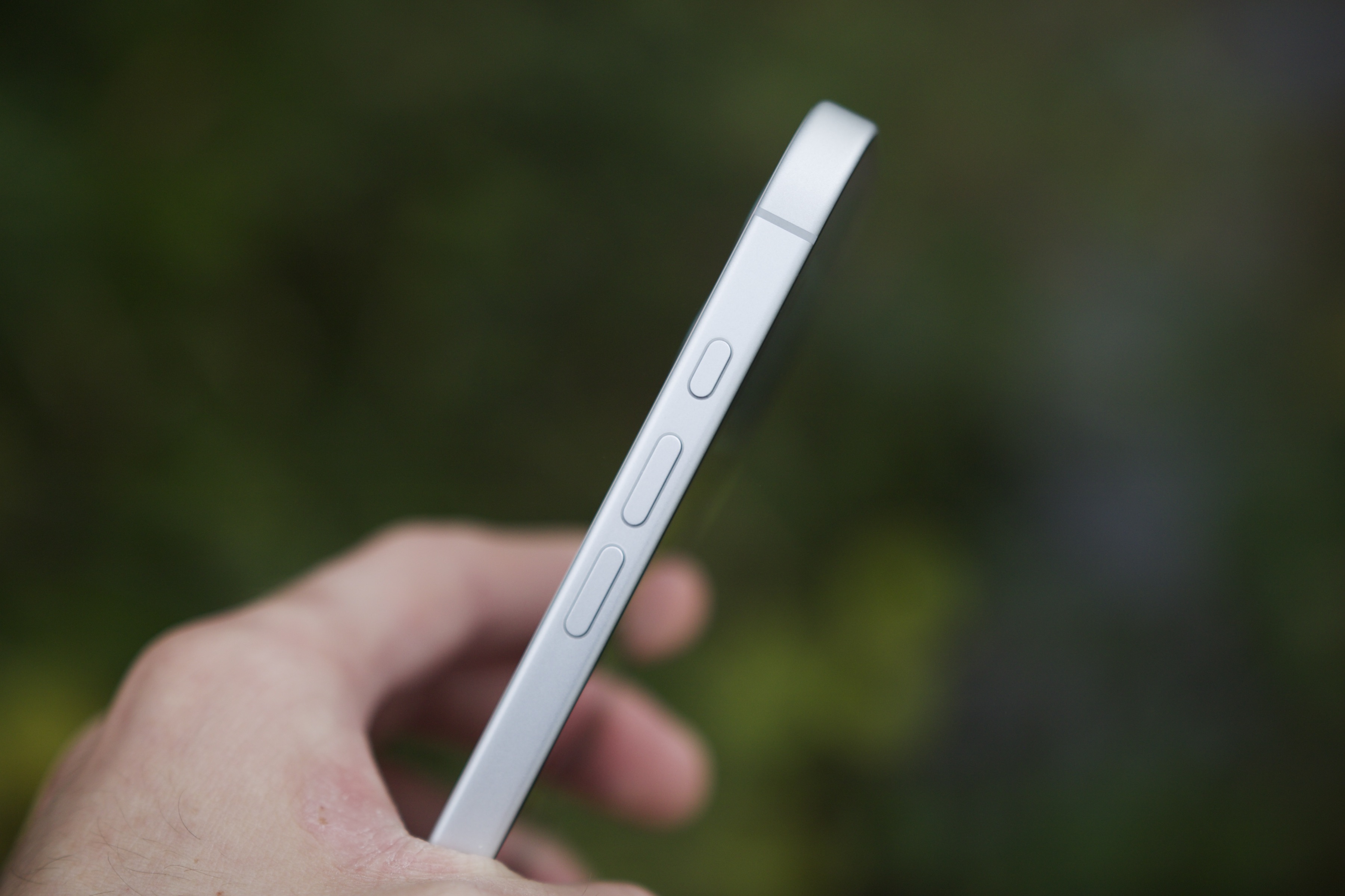 Alternative text:  Close-up image of the Action button on an iPhone 16.