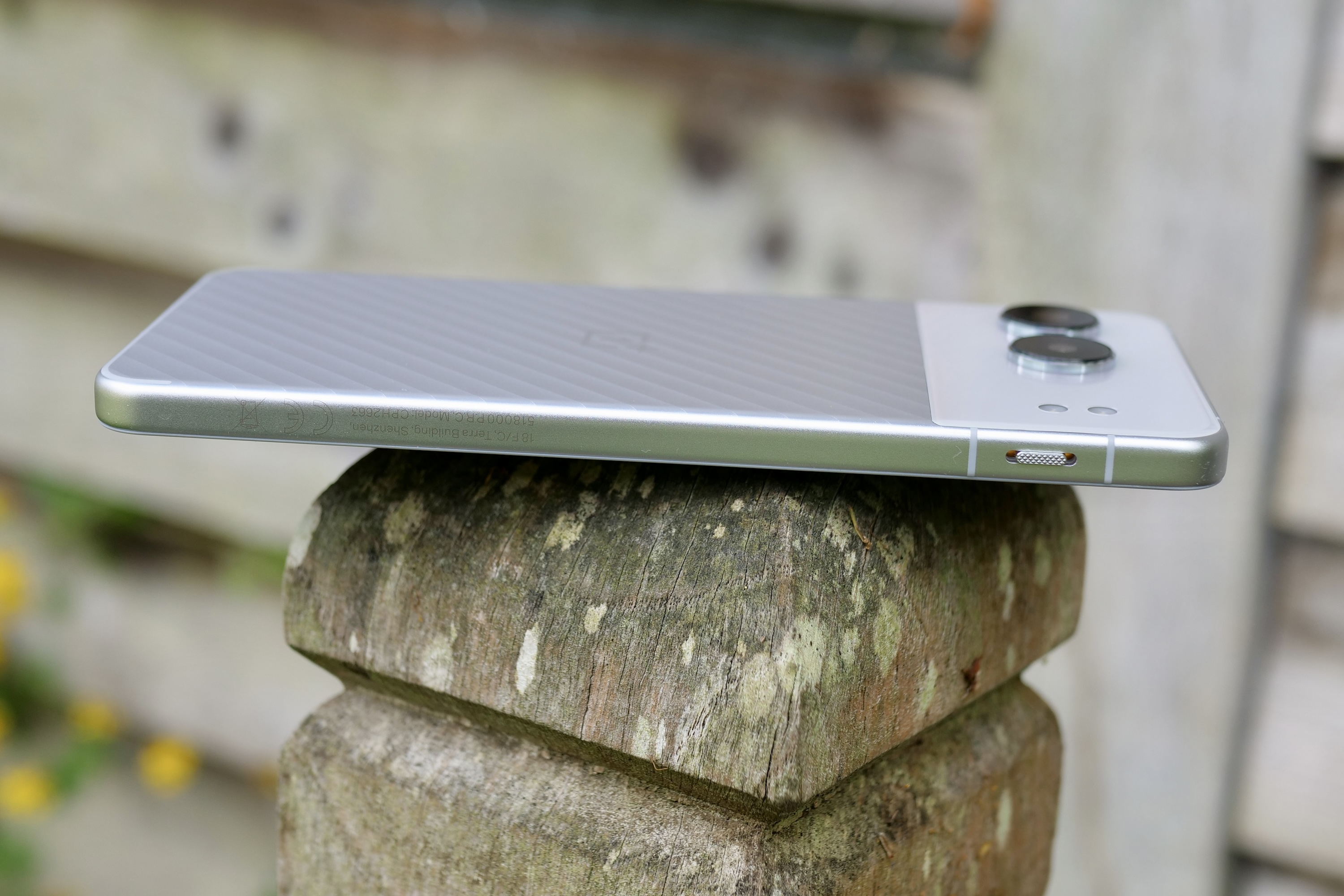 Alternative text: The side of a OnePlus Nord 4 smartphone, featuring the Alert Slider.