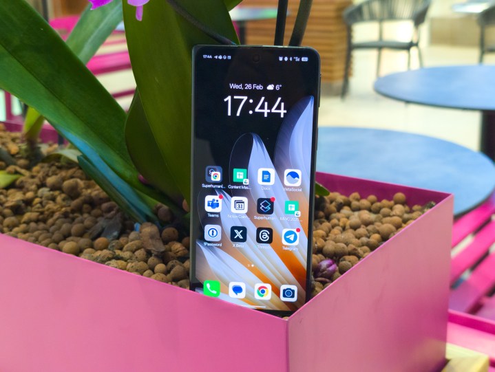 Hero photo featuring the Oppo Find N5 inside a pink planter box