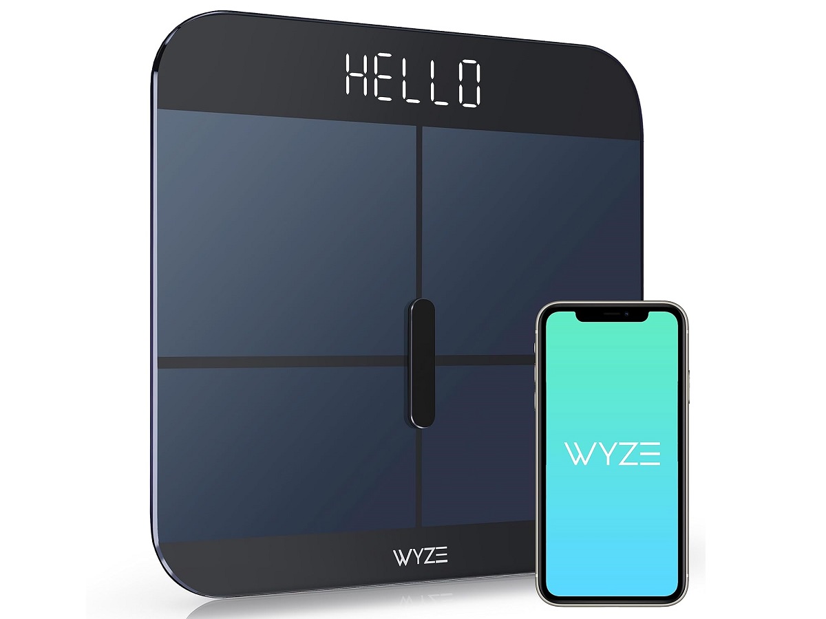 alt: The Wyze Scale X smart scale displaying weight and other metrics.
