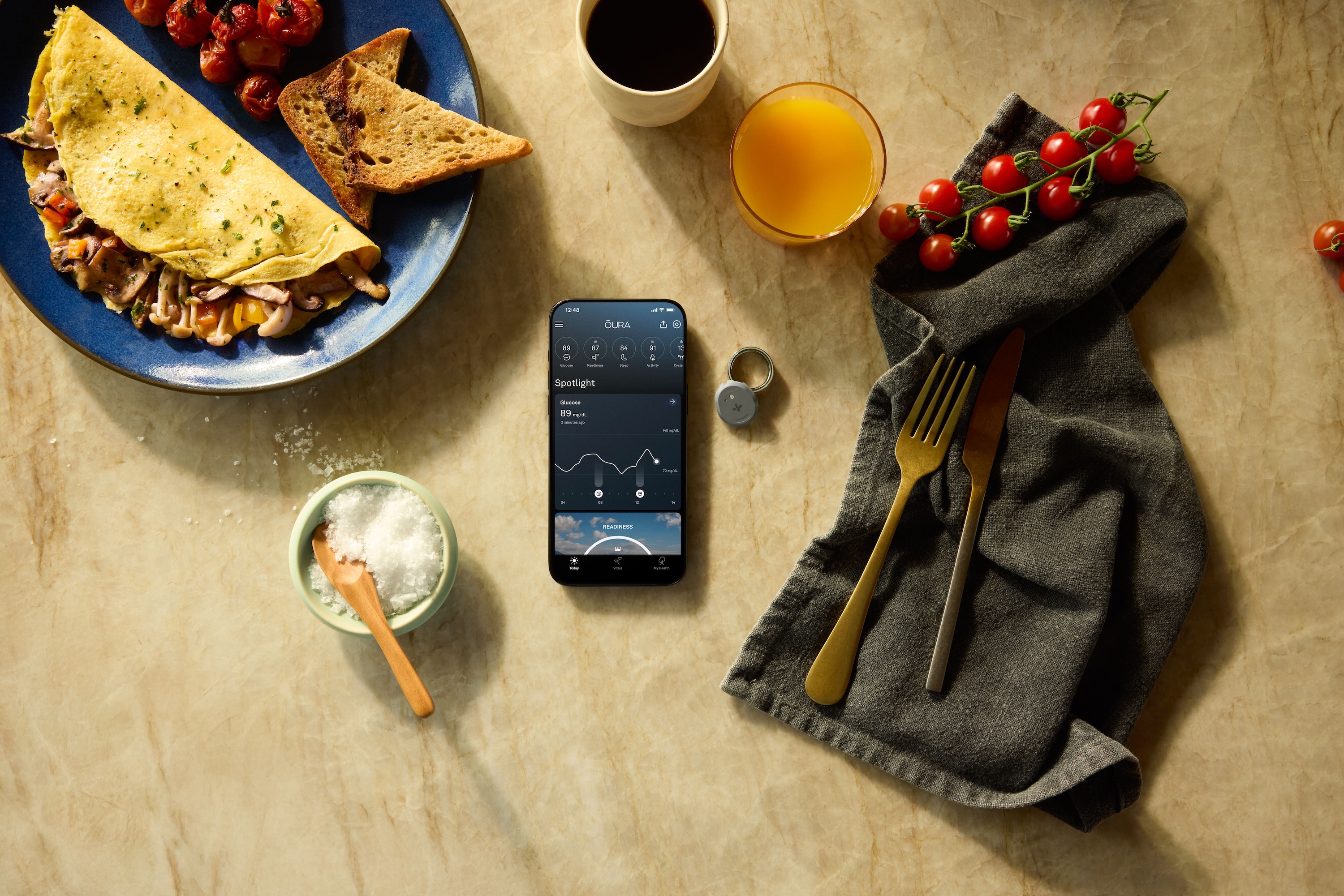 A promotional image for the Oura Ring and Dexcom Stelo integration