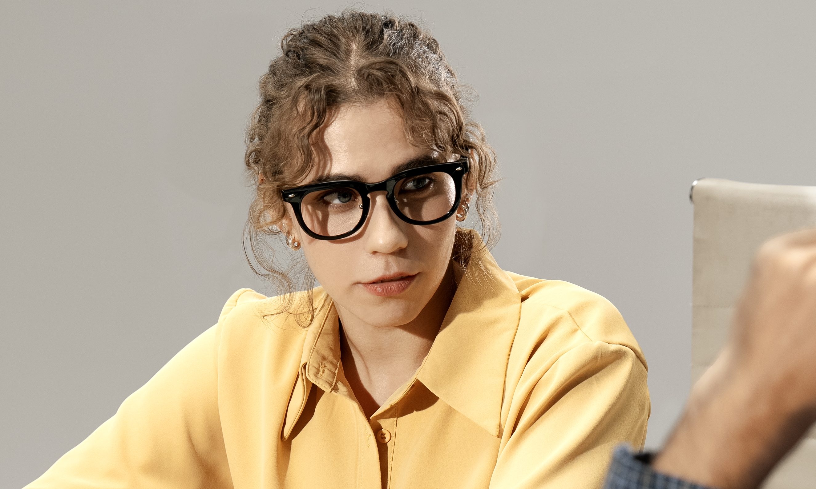 Person wearing Halliday glasses.