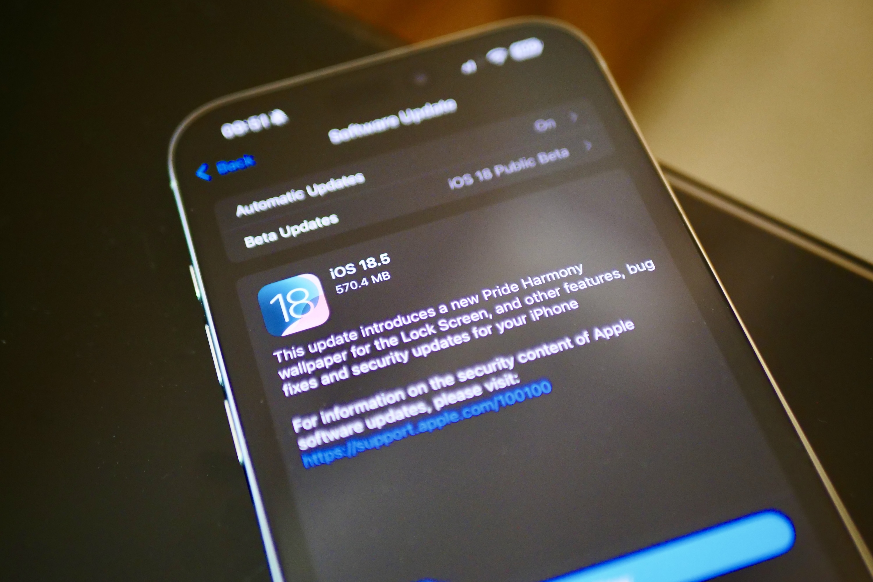 The iOS 18.5 update waiting on an iPhone 16 Pro Max.