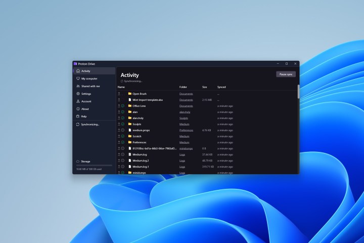 alt=Proton Drive efficiently synchronizes files and folders across multiple devices in real-time.