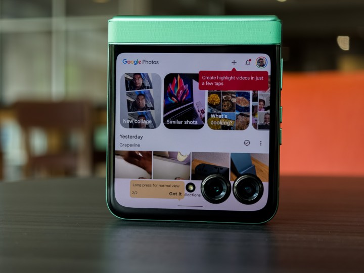 alt: The Motorola Razr 2025 partially open, displaying a YouTube video on the main display.