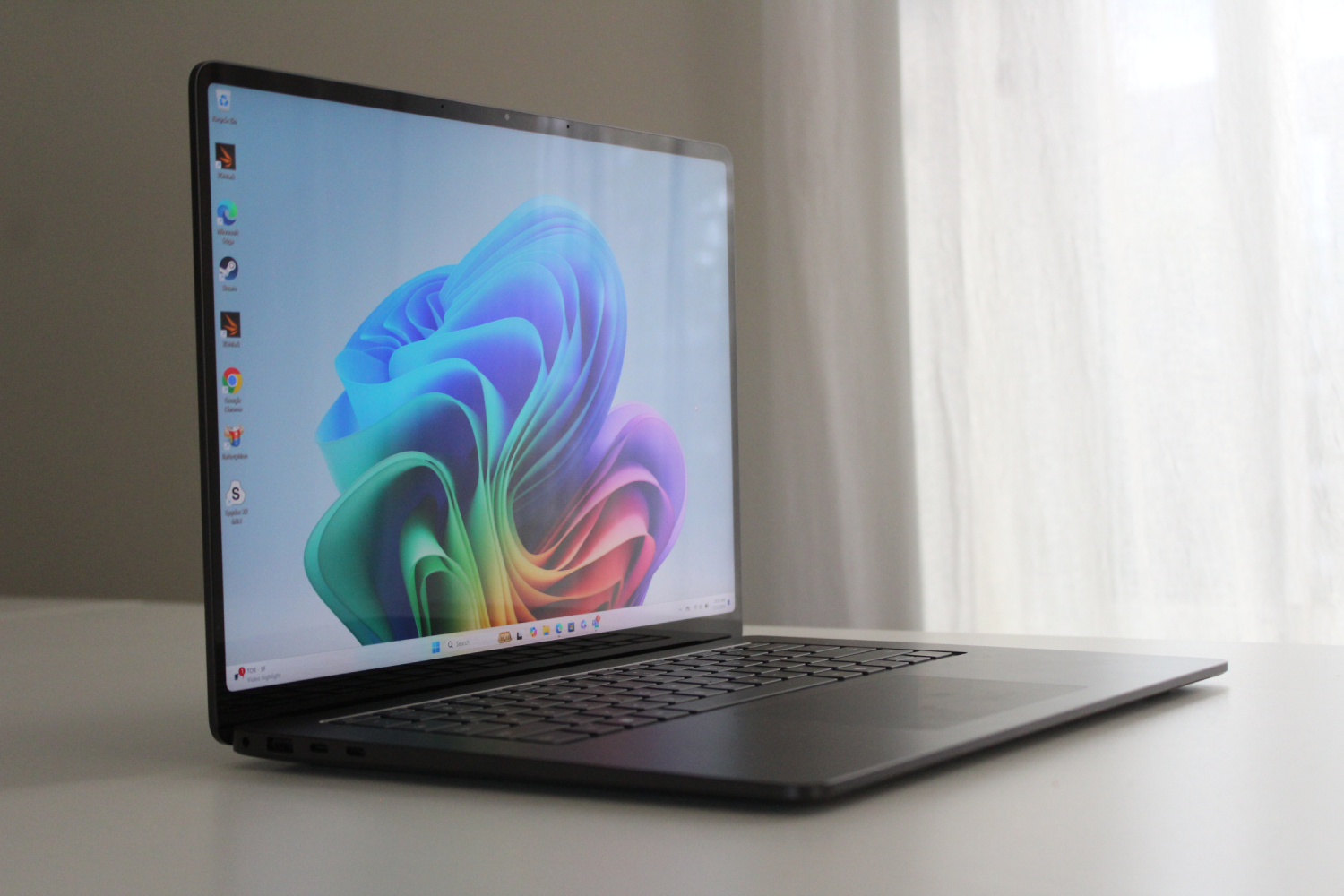Microsoft Surface Laptop 7th Edition on a minimalist white desk setup