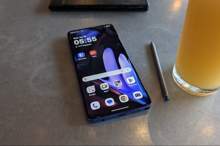 Moto G Stylus 2025 resting on a wooden table, screen off, highlighting its sleek design