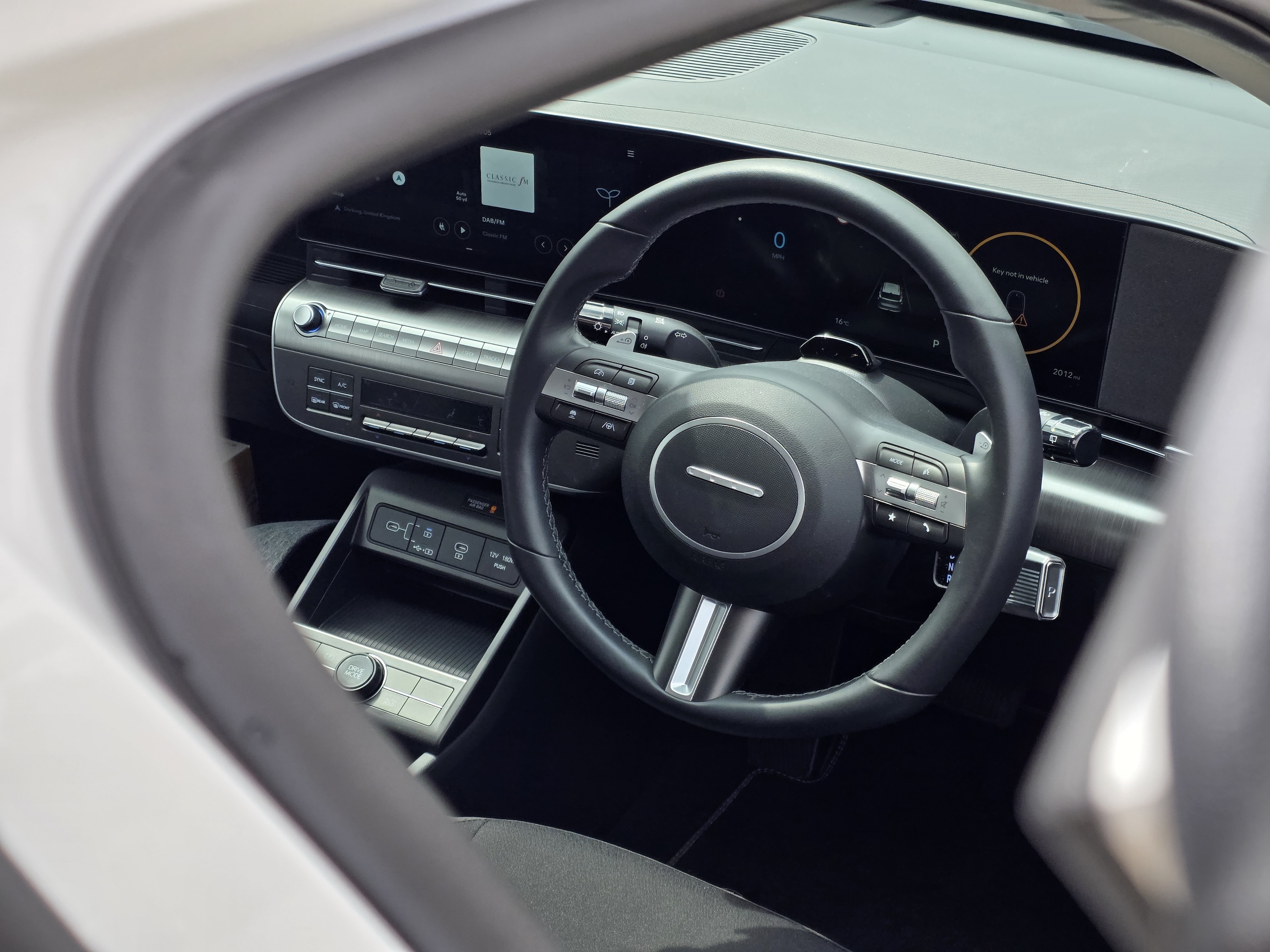 Detailed dashboard shot of Hyundai Kona Electric taken with Galaxy S25 Edge 2x zoom, showcasing sharp text on buttons.