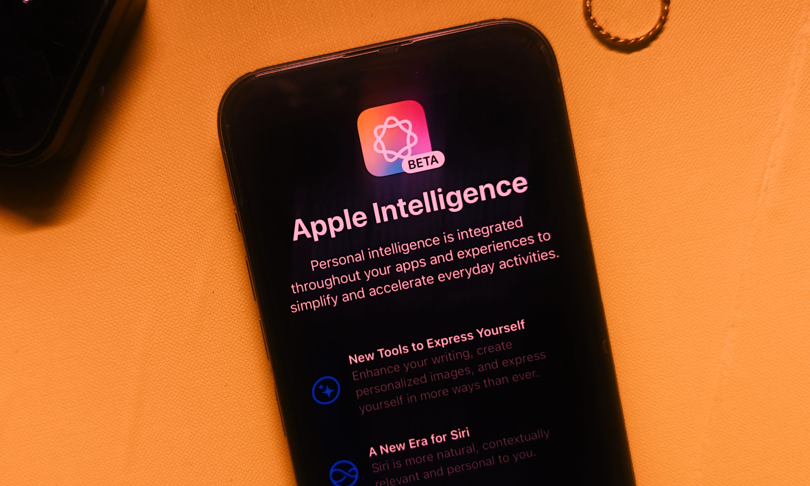 The Apple Intelligence interface showcased on an iPhone 15 Pro Max, highlighting on-device AI capabilities.