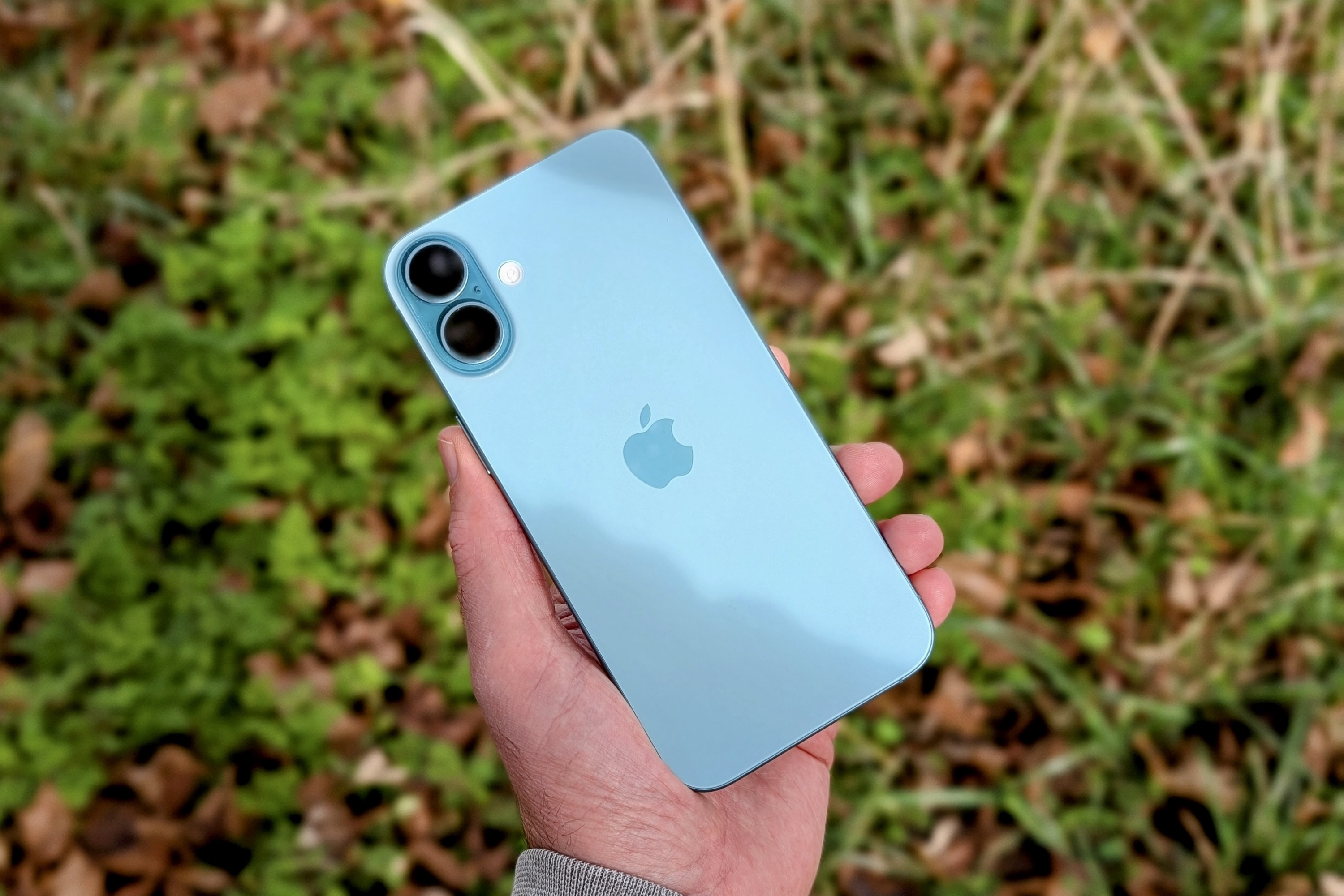 Close-up of the Apple iPhone 16 Plus held in hand, showcasing its design for users considering alternatives to the Razr 2025 within the Apple ecosystem.